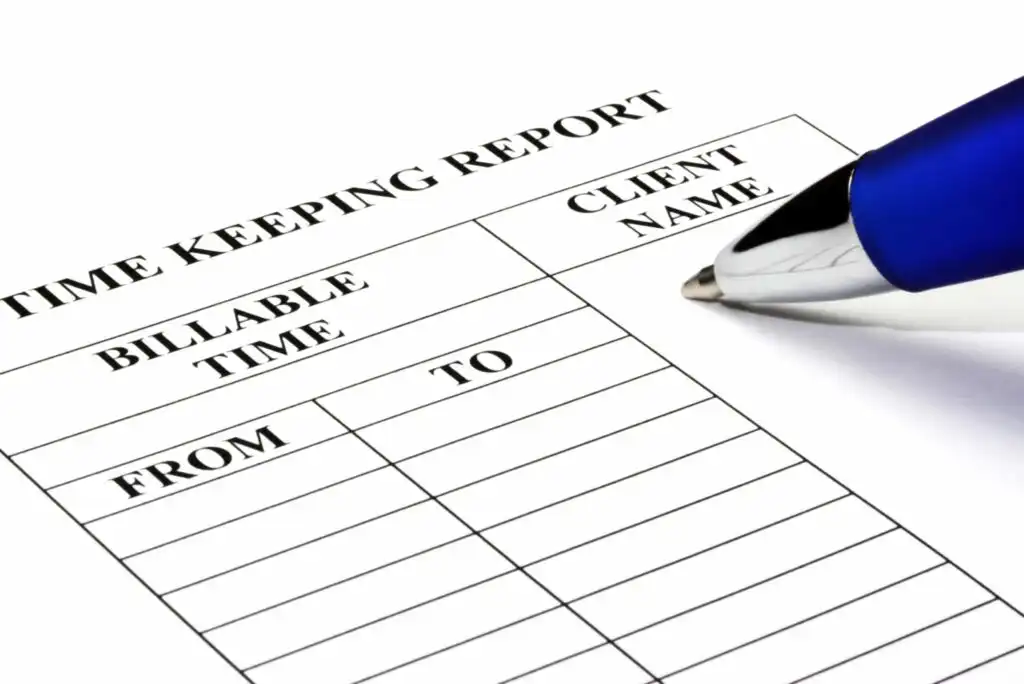 A close-up of a time keeping report form with columns for billable time, client name, and time from/to. A blue pen rests on the form, ready to write. The form is blank.