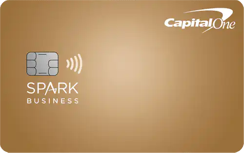 A gold-colored Capital One credit card labeled Spark Business with a chip and contactless symbol on the left side, and the Capital One logo in white on the top right corner.