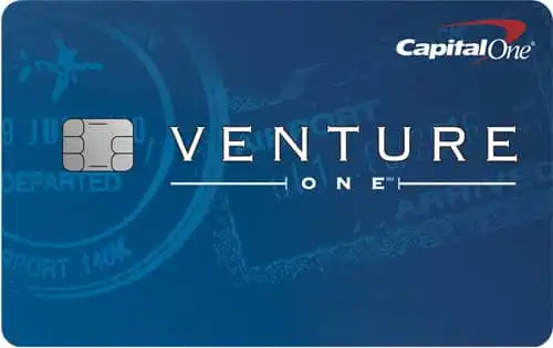 A blue Capital One VentureOne credit card featuring a chip and travel-themed background, with Capital One and VentureOne logos prominently displayed.