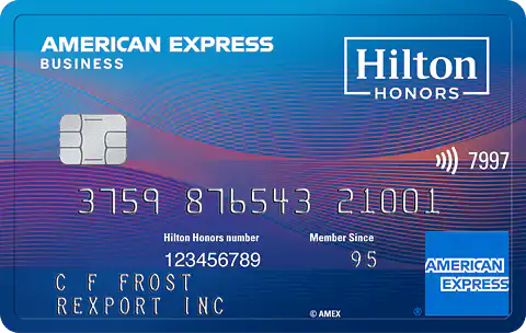 A blue American Express Hilton Honors Business credit card displaying a chip, card number, Hilton Honors number, member since year, and cardholder name. Hilton Honors and American Express logos are shown.
